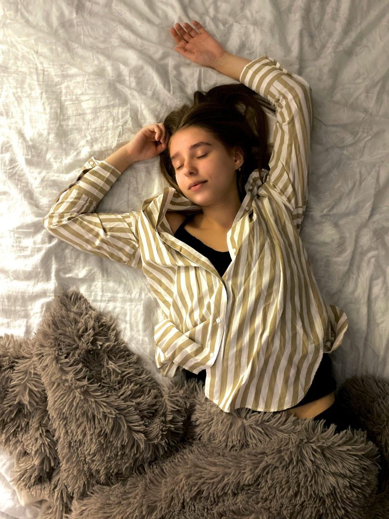 Person resting on a bed