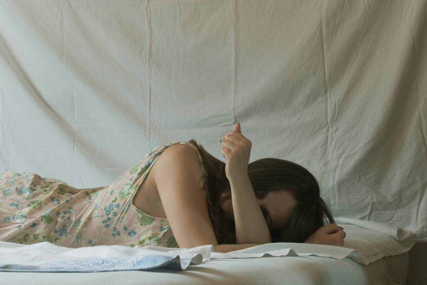 Person lying on a bed